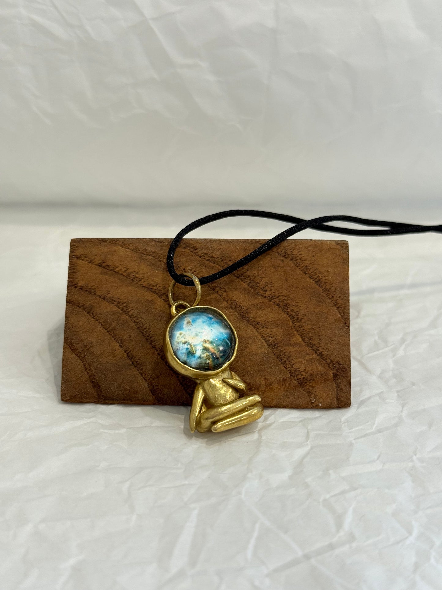 Brass astronauts in yoga poses