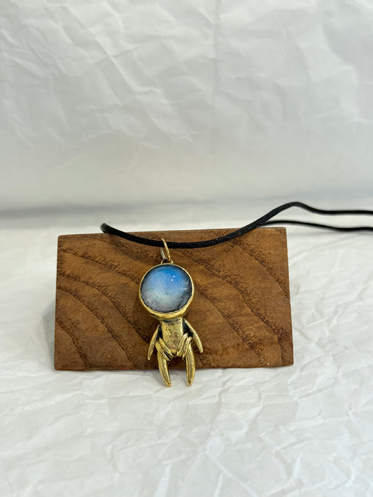 Brass astronauts in yoga poses